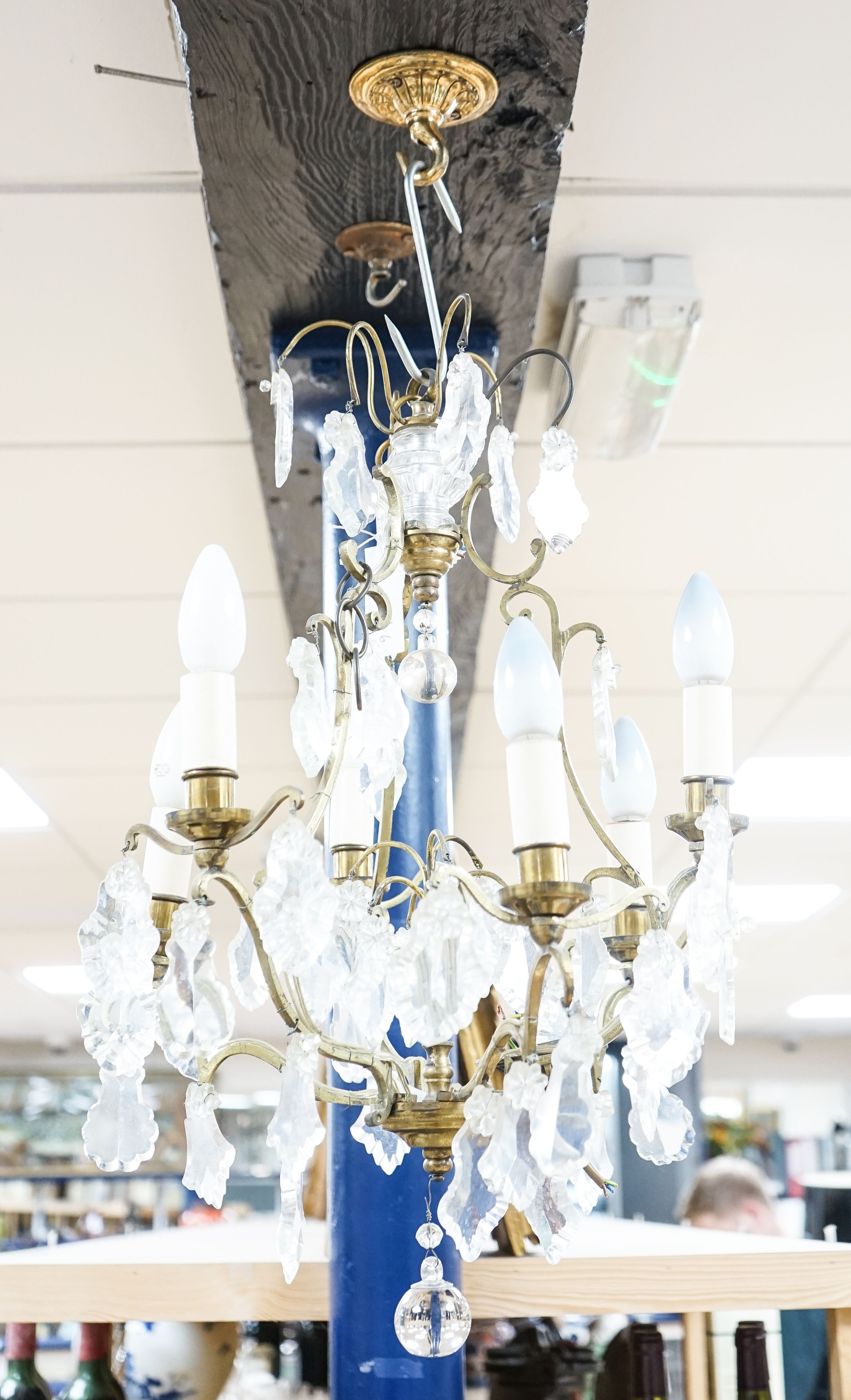 A six branch brass and glass lustre hung chandelier, height 60cm